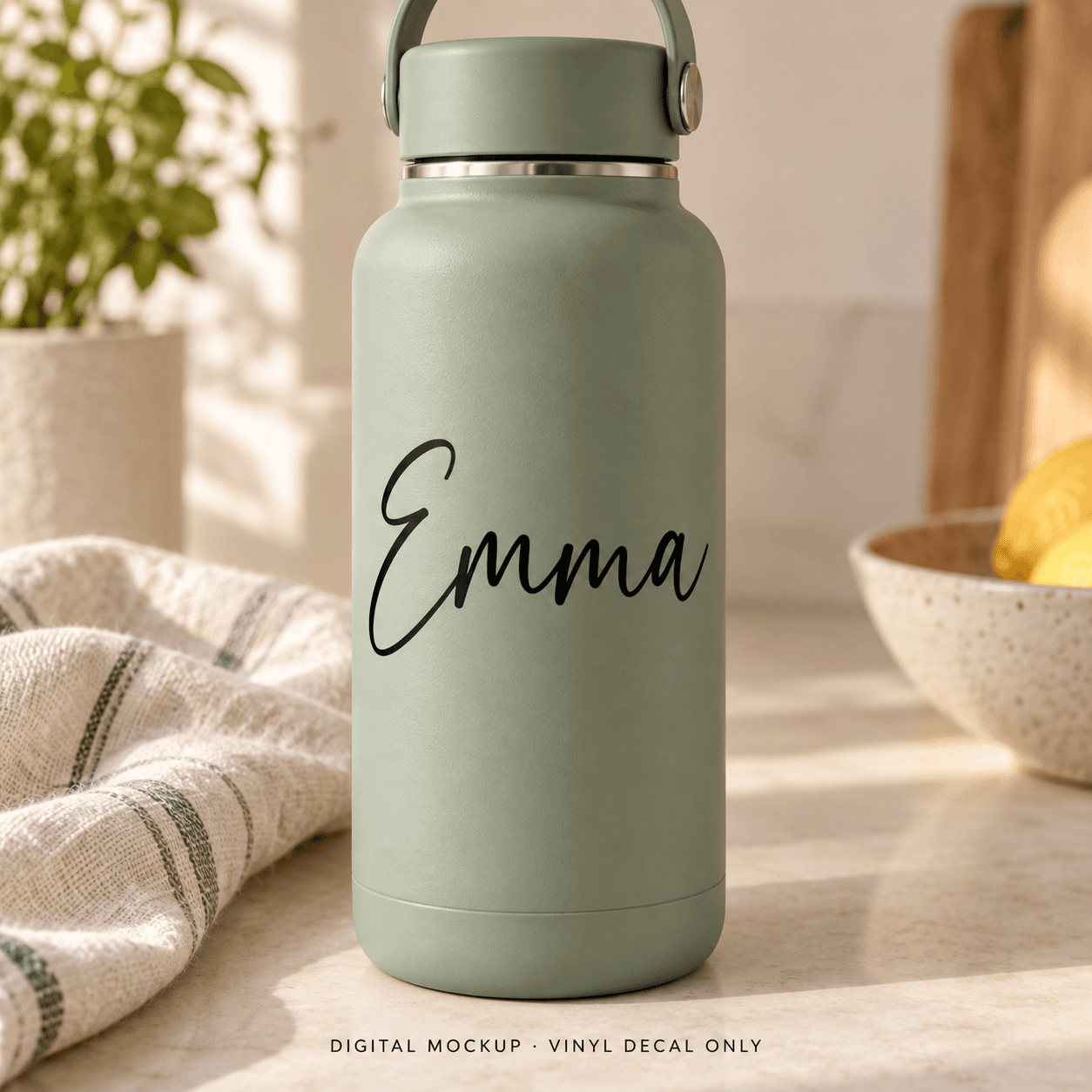 Digital mockup: Black script name "Emma" on a sage water bottle. Vinyl decals only; props are not included.