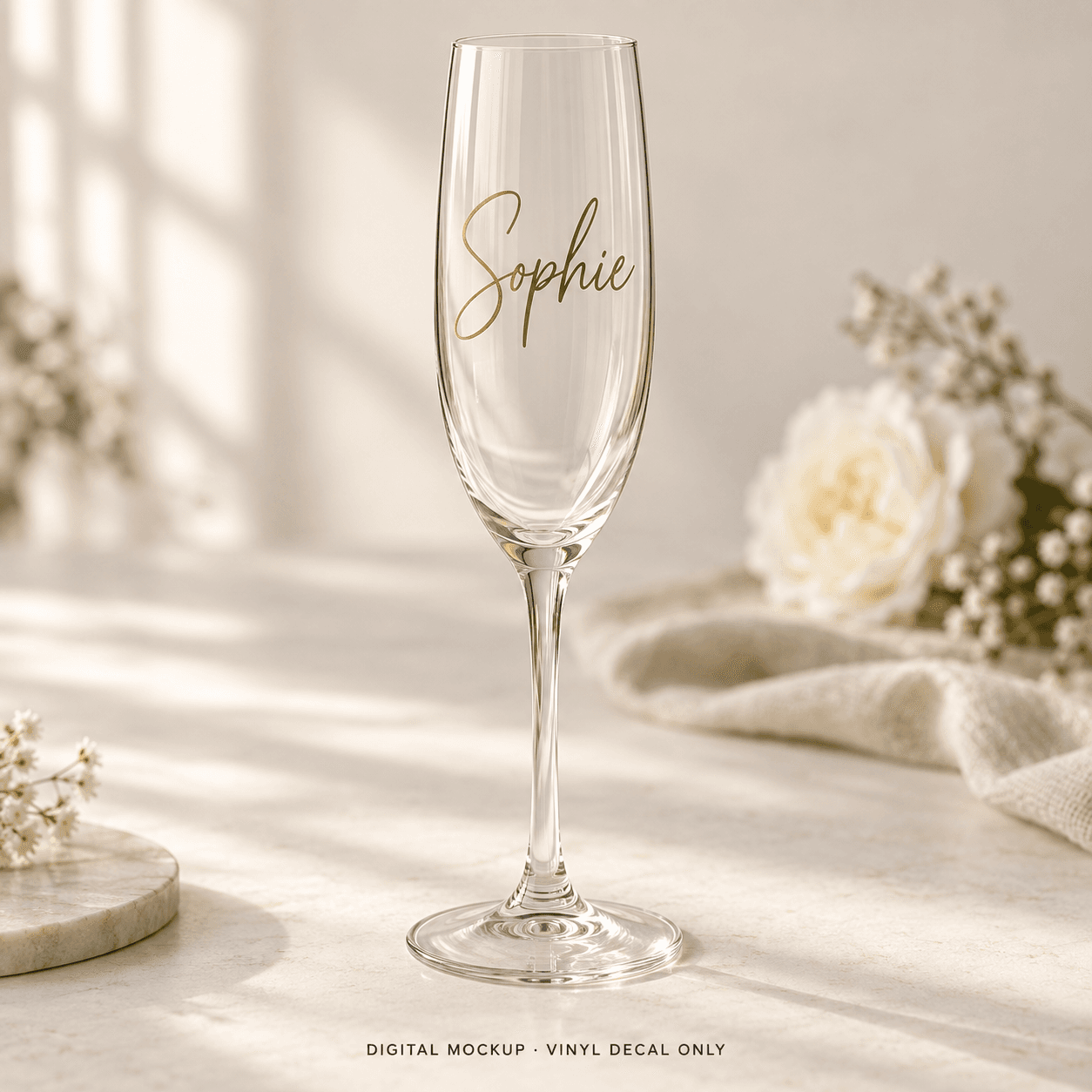 Digital mockup: Gold script name "Sophie" on a champagne flute. Vinyl decal only; props are not included.